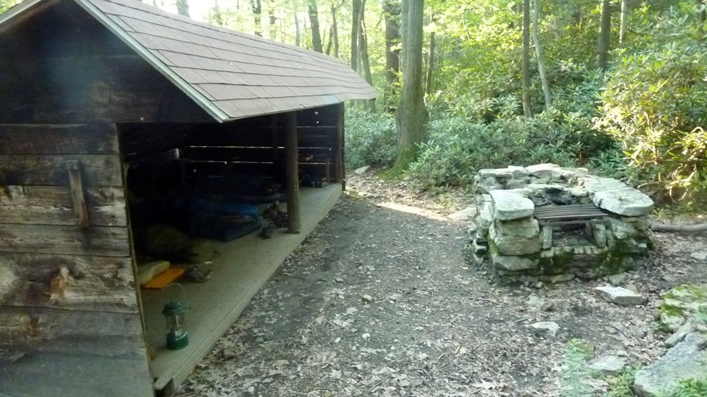 Adirondack shelter with fire pit